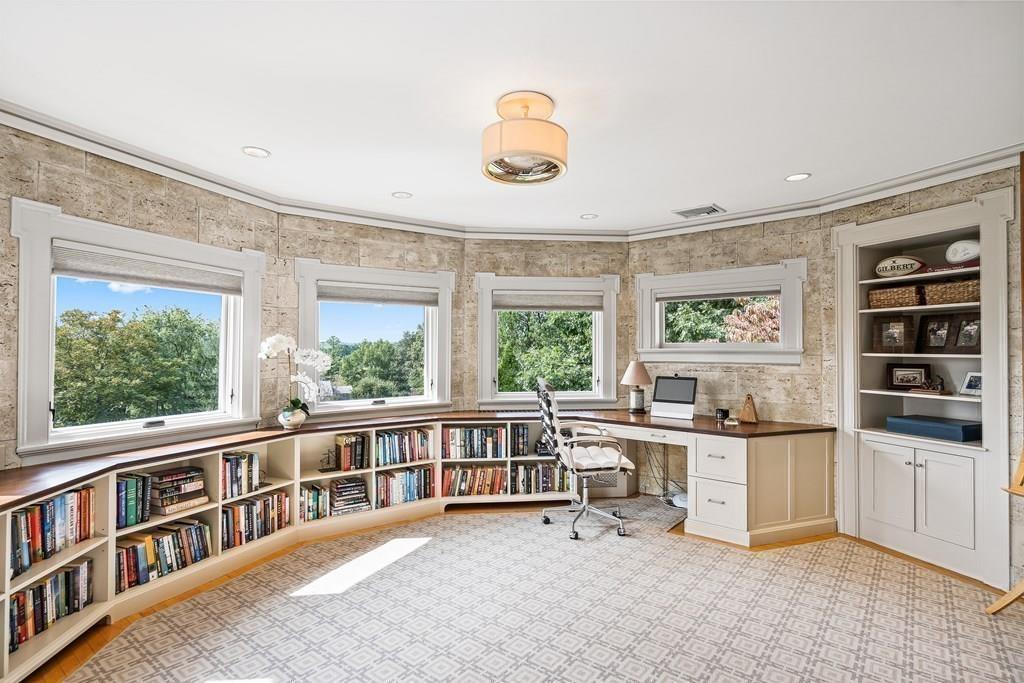 62-66 Temple Road Wellesley, MA 02482 - Photo 17 of 36 a view of a livingroom with furniture cabinet and windows