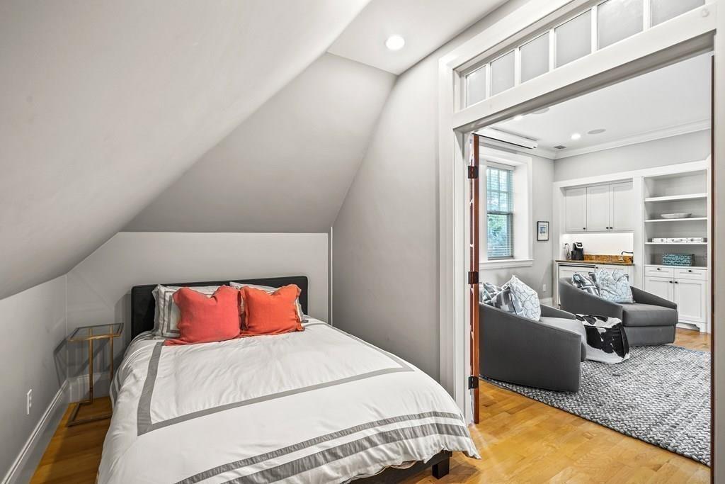 62-66 Temple Road Wellesley, MA 02482 - Photo 23 of 36 a bedroom with a bed and glass windows