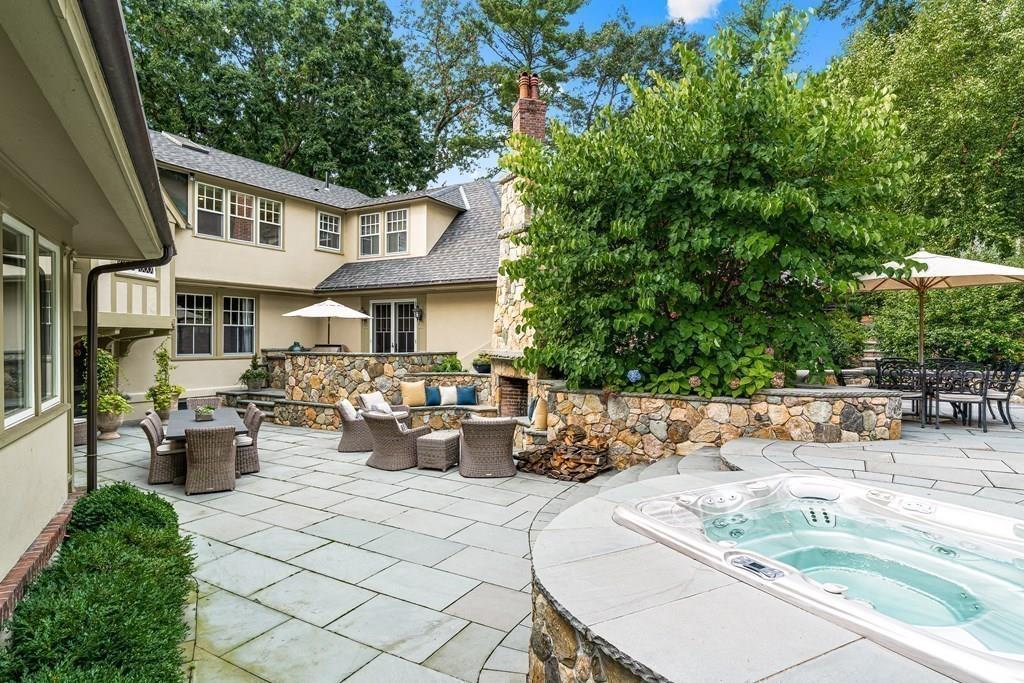 62-66 Temple Road Wellesley, MA 02482 - Photo 25 of 36 a view of a patio with couches and table and chairs and potted plants