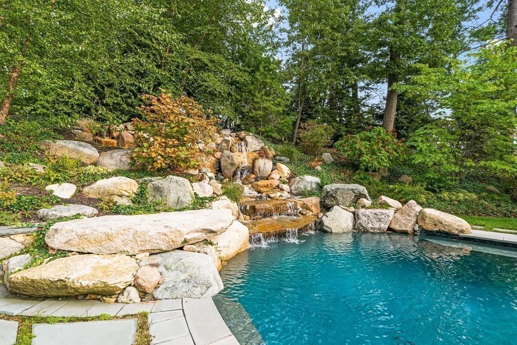 62-66 Temple Road Wellesley, MA 02482 - Photo 27 of 36 a backyard of a house with lots of green space