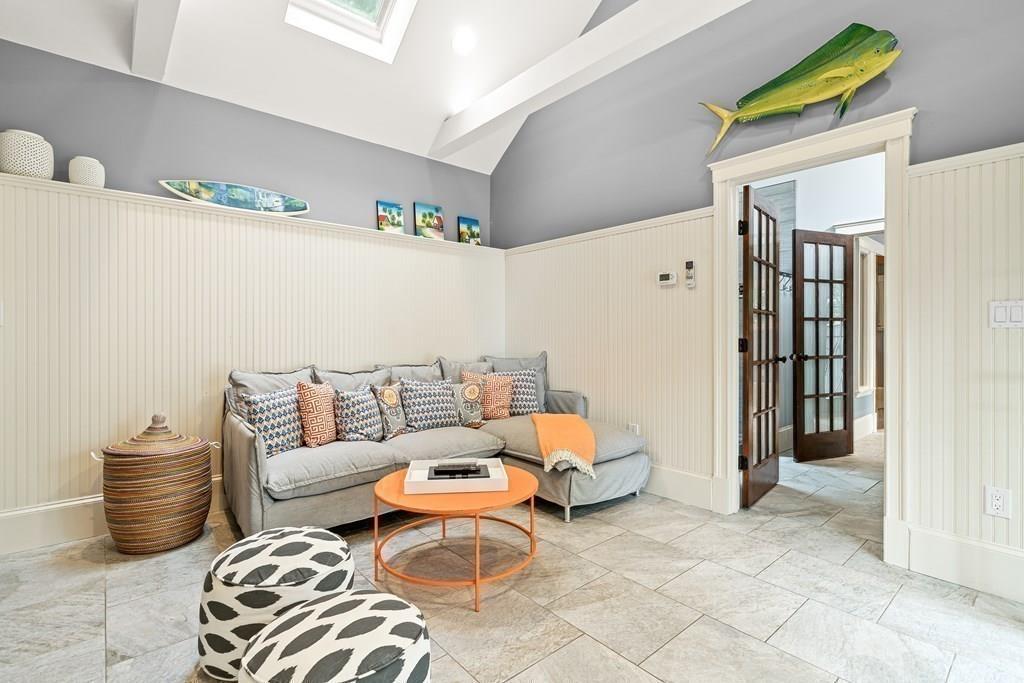 62-66 Temple Road Wellesley, MA 02482 - Photo 30 of 36 a living room with furniture and a rug