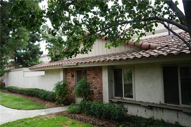 a view of a house with a tree