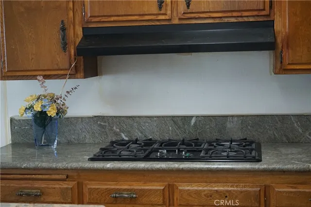 a kitchen with a stove and cabinets