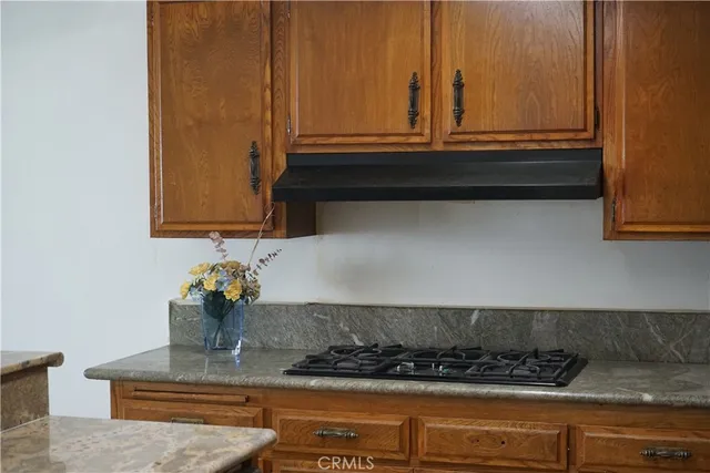 a kitchen with a stove and a cabinet