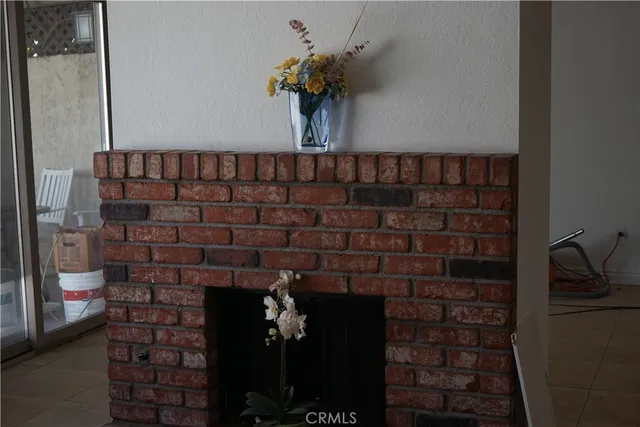 an empty room with wooden floor and a window