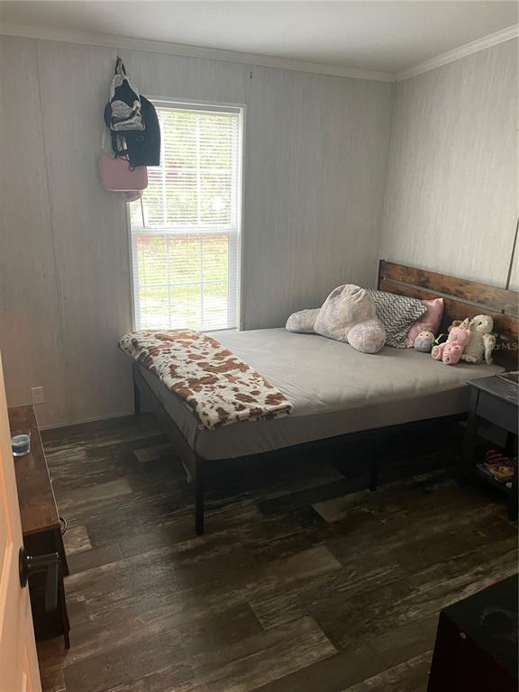 6505 Oil Well Road Clermont, FL 34714 - Photo 15 of 30 a bedroom with a bed and a window