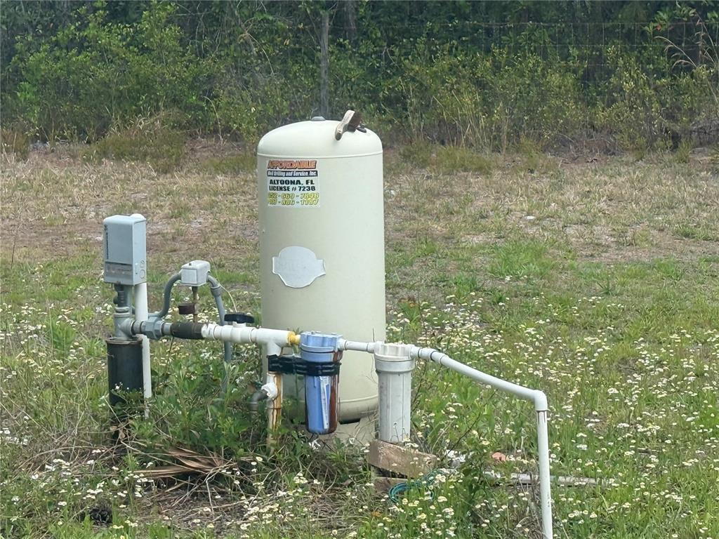 6505 Oil Well Road Clermont, FL 34714 - Photo 21 of 30 a front view of a house with a yard