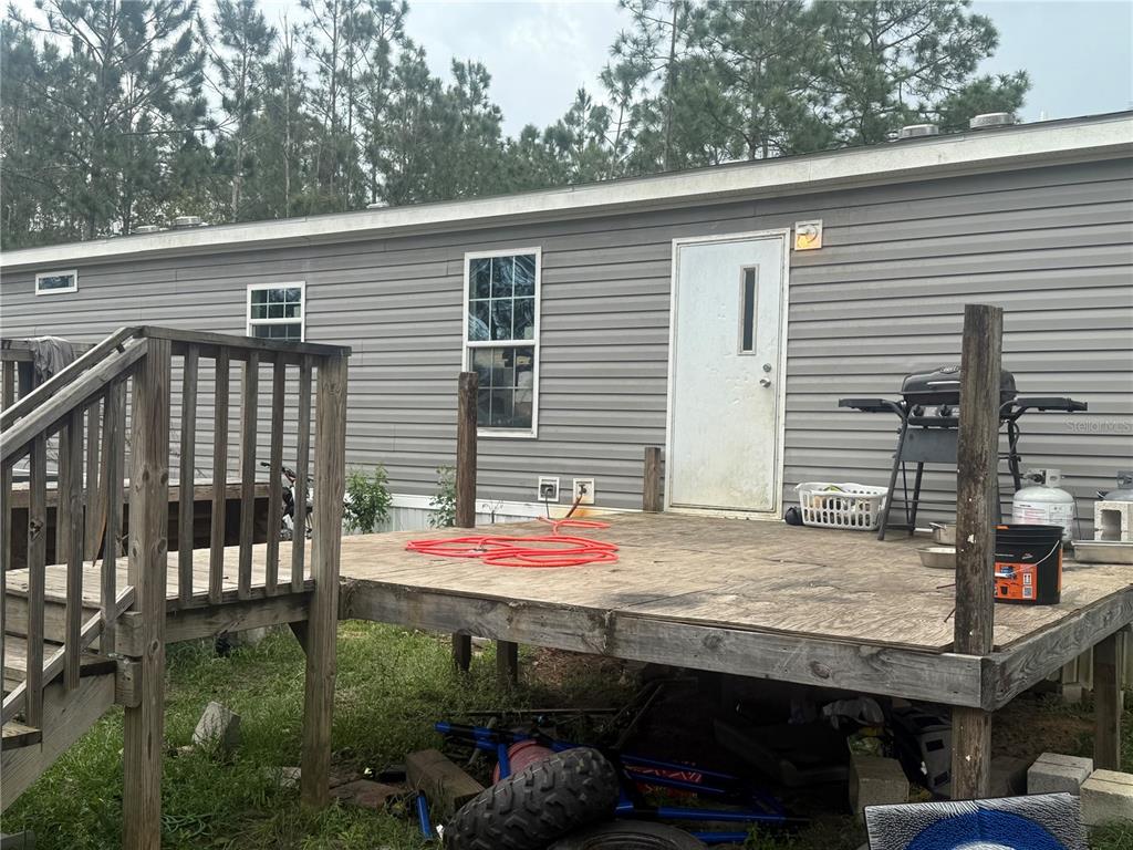 6505 Oil Well Road Clermont, FL 34714 - Photo 25 of 30 a patio with table and chairs