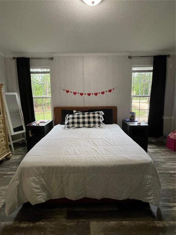 6505 Oil Well Road Clermont, FL 34714 - Photo 8 of 30 a bedroom with a bed and window