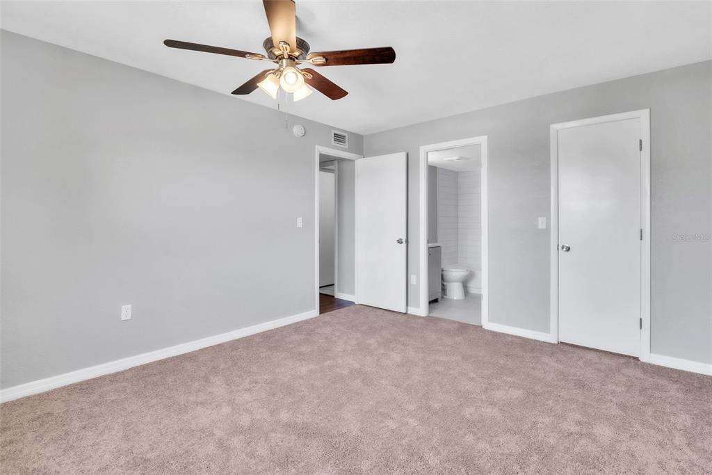 3281 South Beneva Road, Unit 202 Sarasota, FL 34232 - Photo 16 of 26 a view of an empty room and a ceiling fan