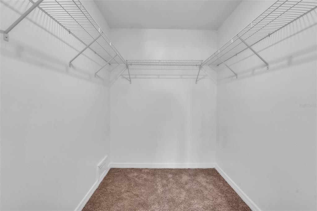 3281 South Beneva Road, Unit 202 Sarasota, FL 34232 - Photo 19 of 26 a view of a room with racks on the wall