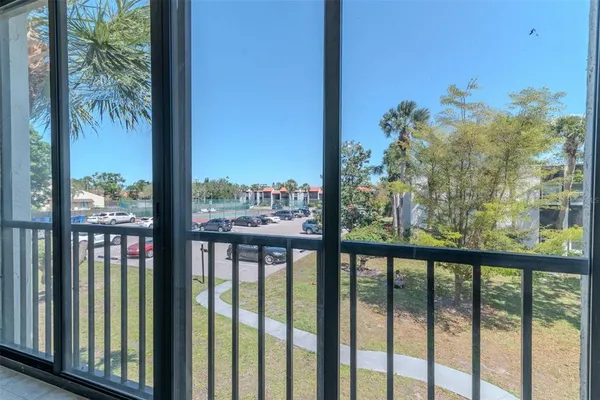 a view of a balcony with wooden floor