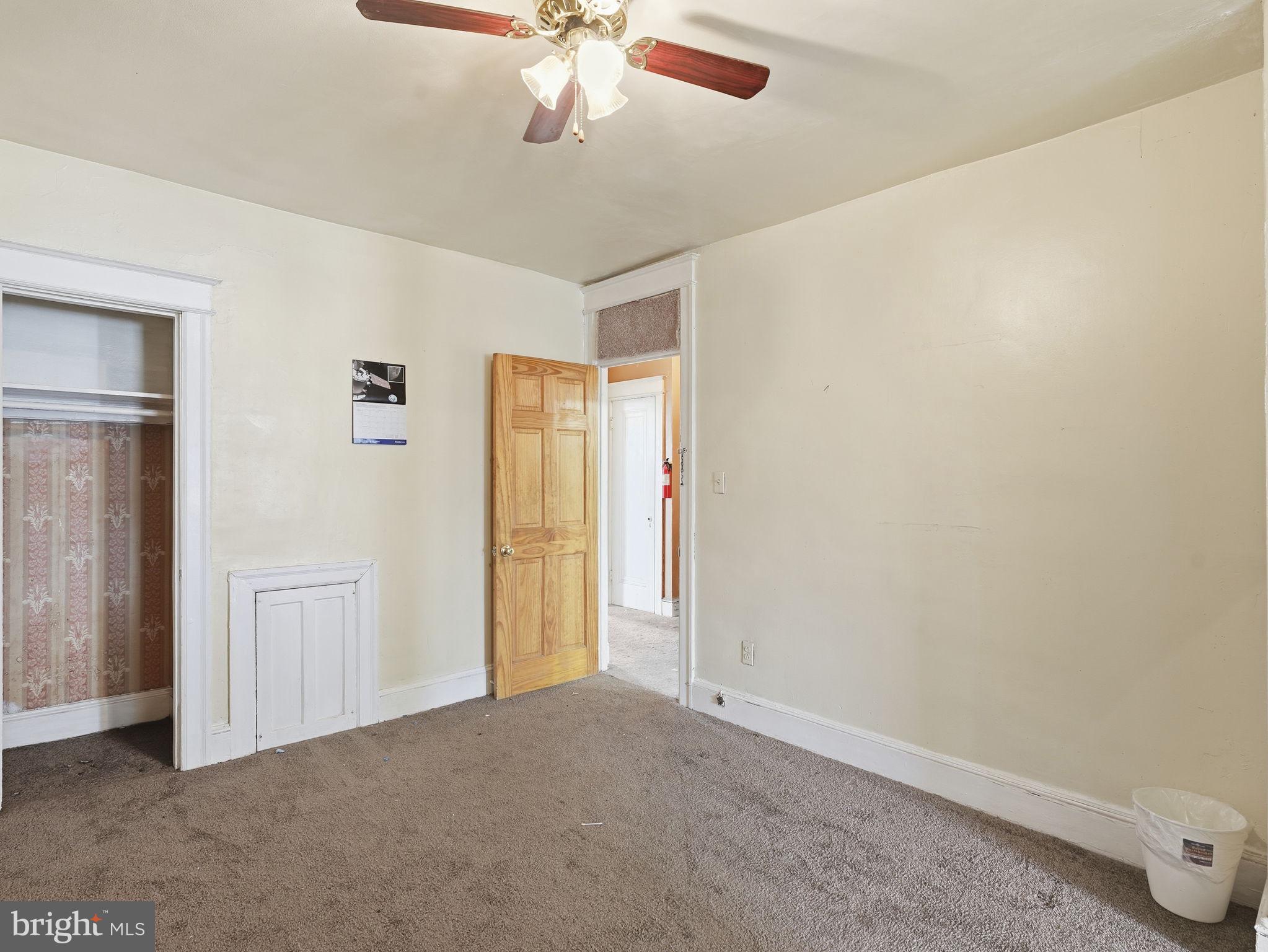 5733 9th Street Northwest Washington, DC 20011 - Photo 13 of 20 an empty room with a chandelier fan