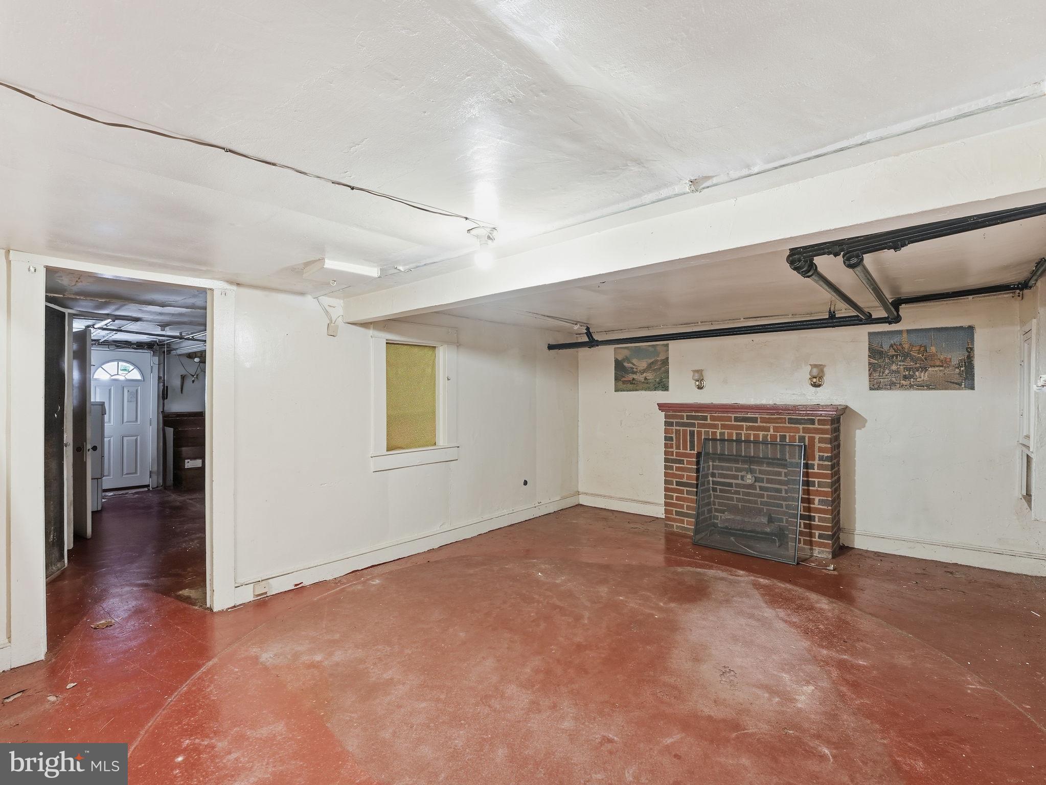 5733 9th Street Northwest Washington, DC 20011 - Photo 15 of 20 an empty room with wooden floor and fireplace