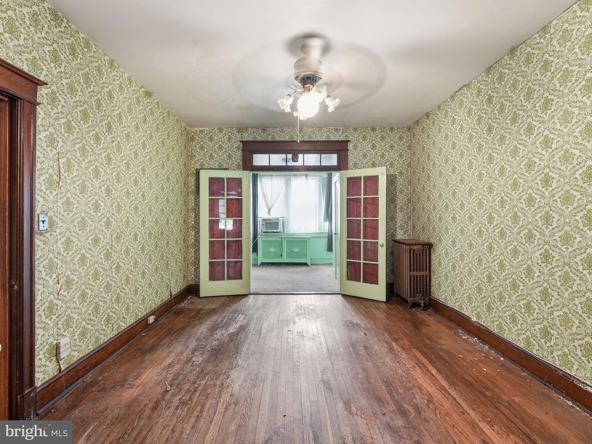 5733 9th Street Northwest Washington, DC 20011 - Photo 5 of 20 wooden floor in an empty room with a window