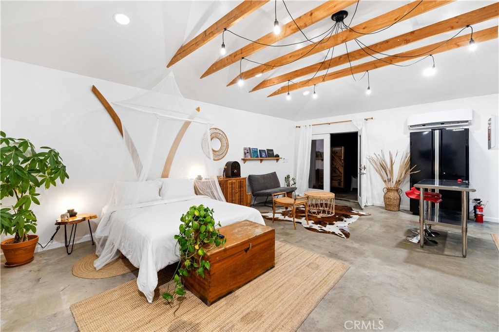 61879 Valley View Circle Joshua Tree, CA 92252 - Photo 50 of 63 a living room with furniture and a chandelier