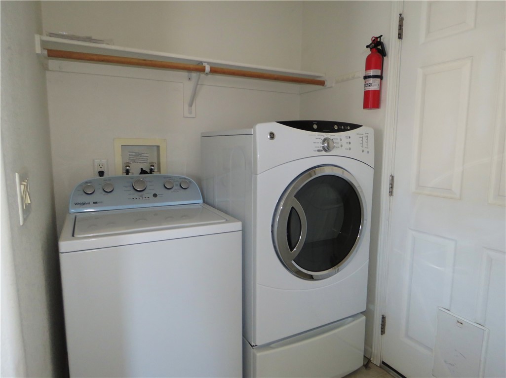 785 Bacobi Road Golden Valley, AZ 86413 - Photo 16 of 35 a utility room with dryer and washer