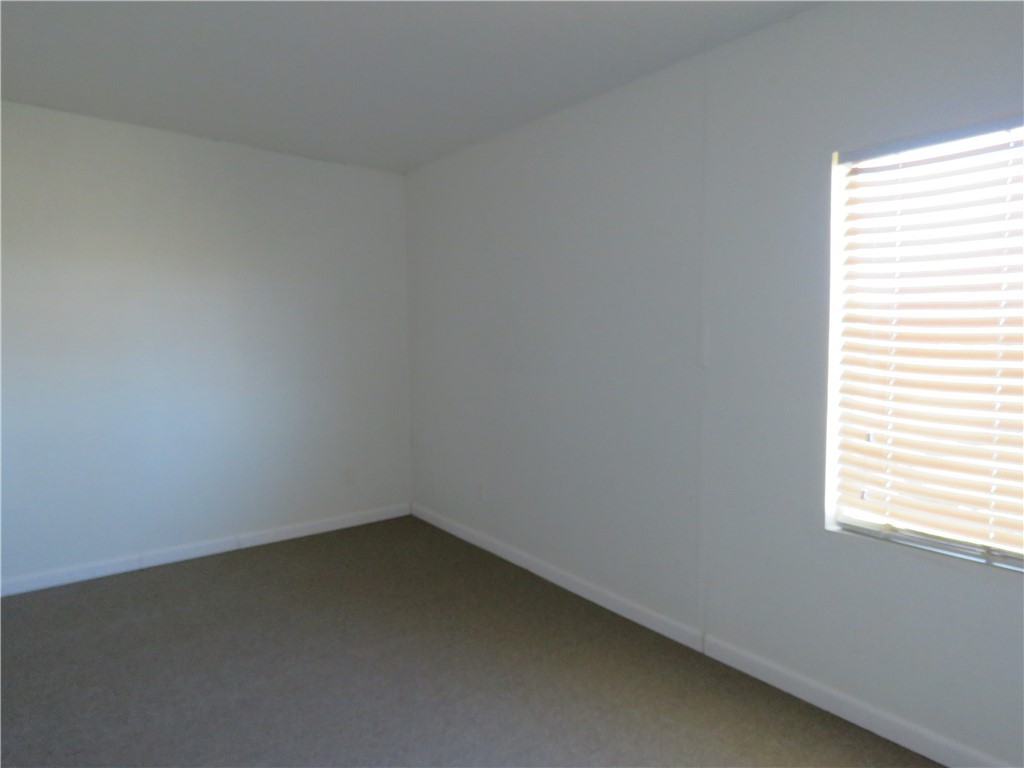 785 Bacobi Road Golden Valley, AZ 86413 - Photo 19 of 35 an empty room with a window