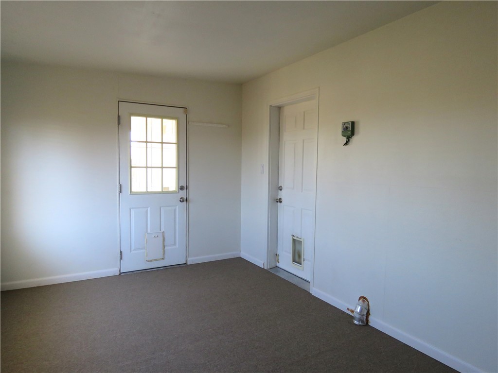 785 Bacobi Road Golden Valley, AZ 86413 - Photo 21 of 35 an empty room with windows