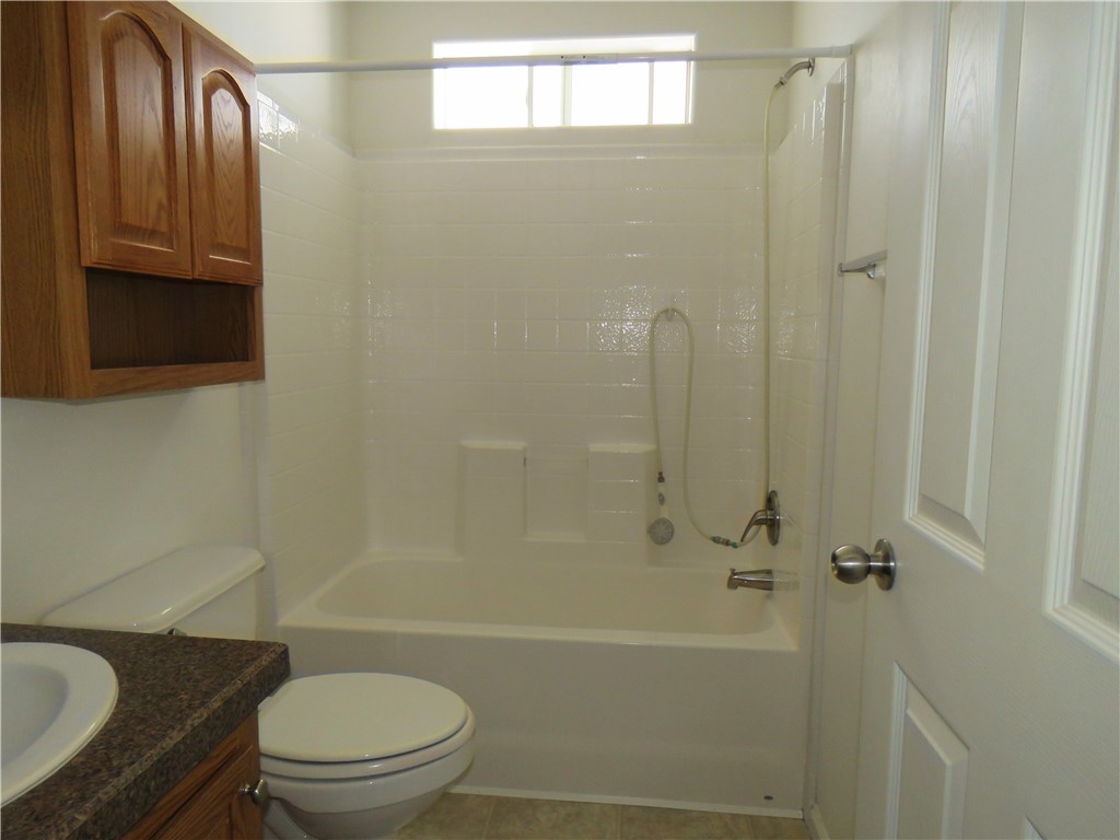 785 Bacobi Road Golden Valley, AZ 86413 - Photo 31 of 35 a bathroom with a sink a toilet and shower