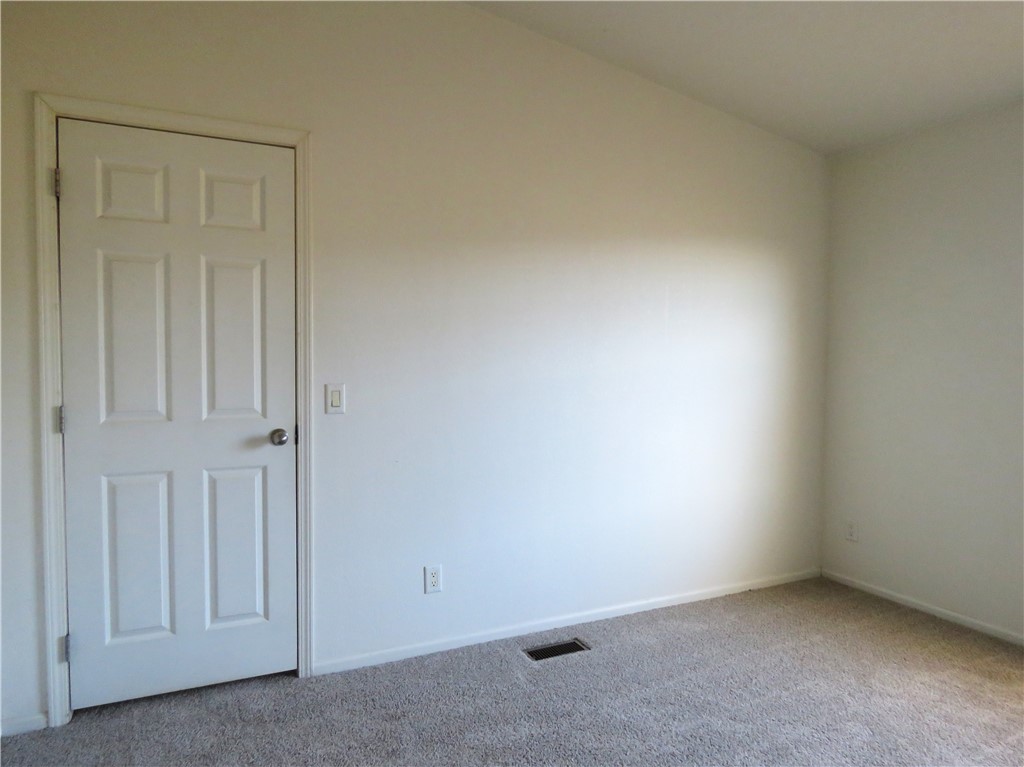 785 Bacobi Road Golden Valley, AZ 86413 - Photo 5 of 35 an empty room with windows