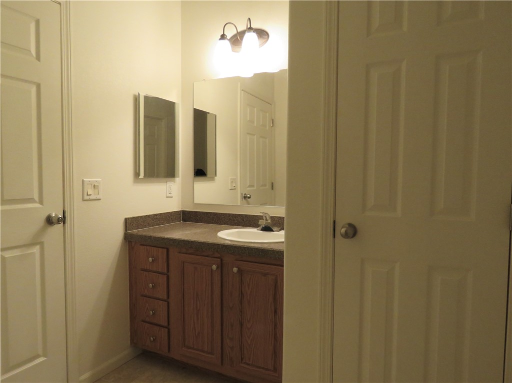 785 Bacobi Road Golden Valley, AZ 86413 - Photo 7 of 35 a bathroom with a sink and mirror