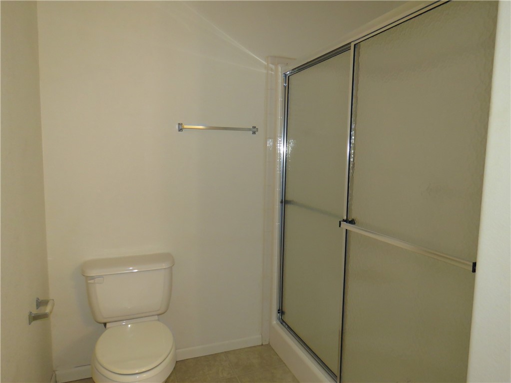 785 Bacobi Road Golden Valley, AZ 86413 - Photo 10 of 35 a white toilet sitting next to a shower