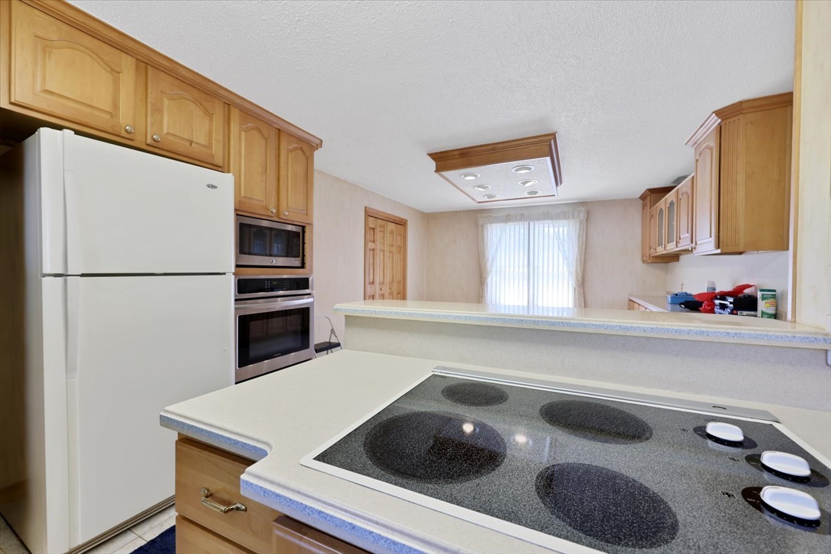 12 Circle Drive Decatur, IL 62521 - Photo 14 of 35 a kitchen with a sink a stove and a refrigerator