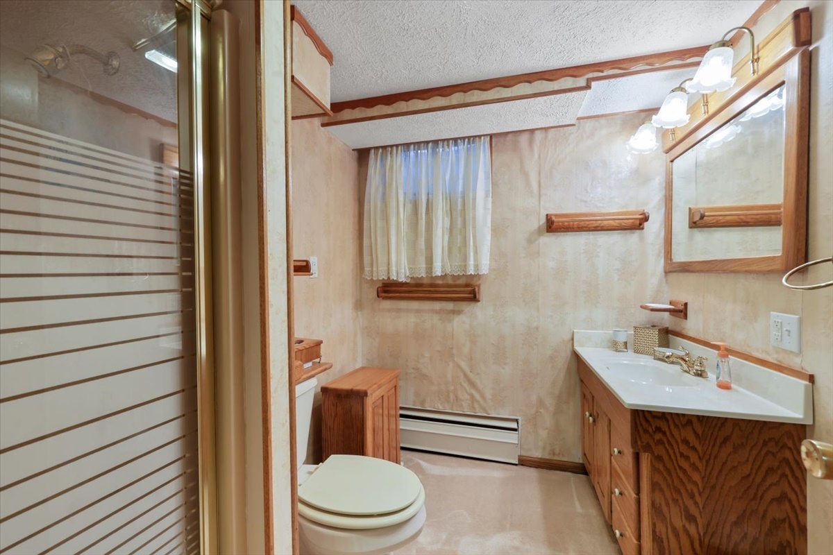 12 Circle Drive Decatur, IL 62521 - Photo 22 of 35 a bathroom with a sink a toilet and shower