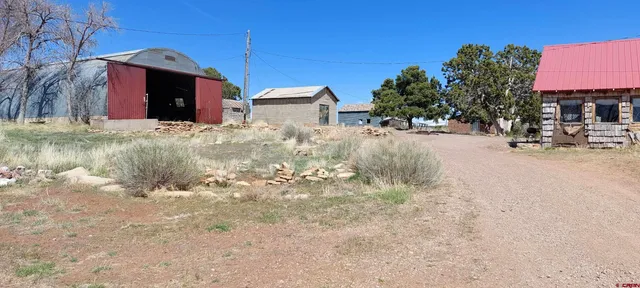 a view of a house with a snow in a yard