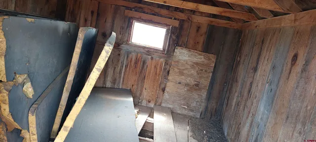 a brick building with a tree in front of it