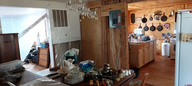 a kitchen with a refrigerator and a stove