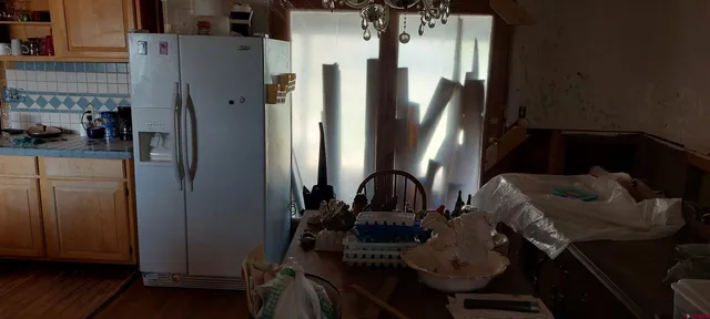 a view of living room with furniture and a window
