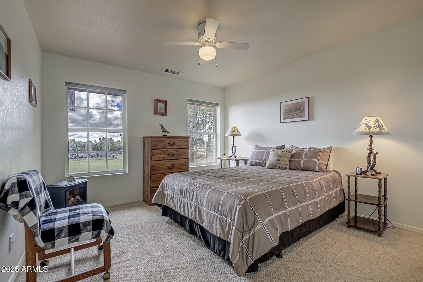155 Claxton Road Payson, AZ 85541 - Photo 24 of 46 a bedroom with a bed a couch and dresser