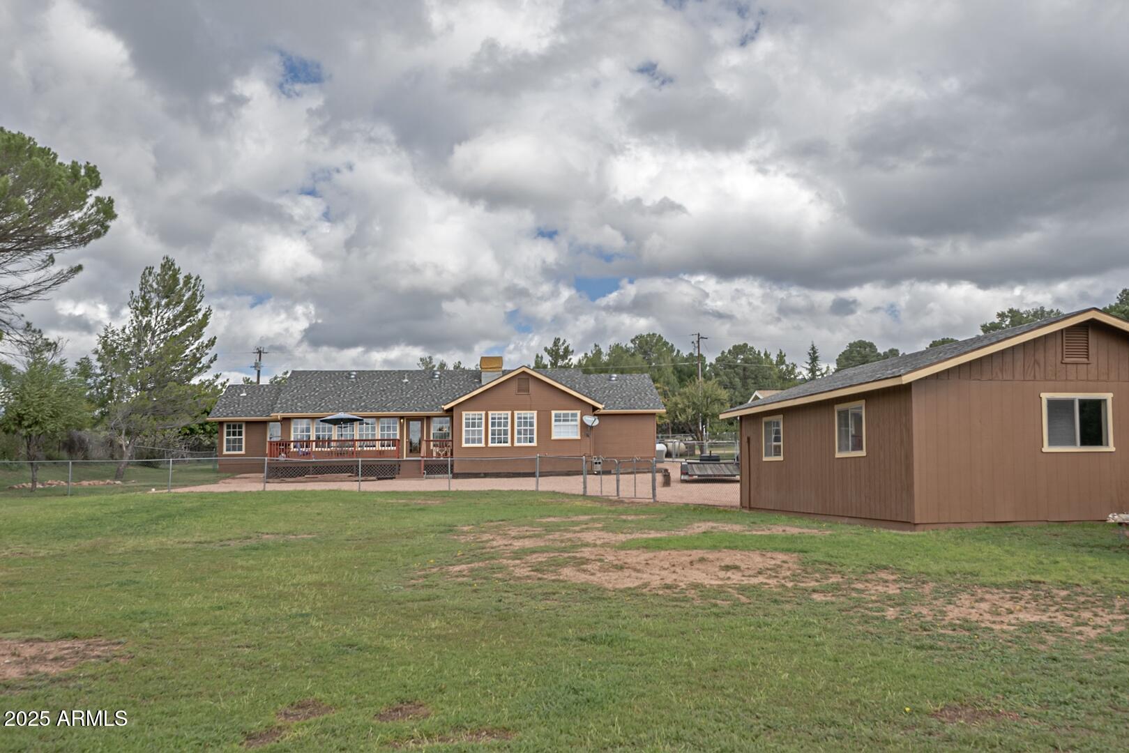 155 Claxton Road Payson, AZ 85541 - Photo 29 of 46 a view of a house with a big yard and large trees