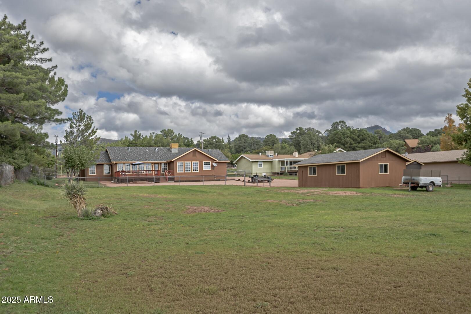 155 Claxton Road Payson, AZ 85541 - Photo 40 of 46 a front view of a house with a garden
