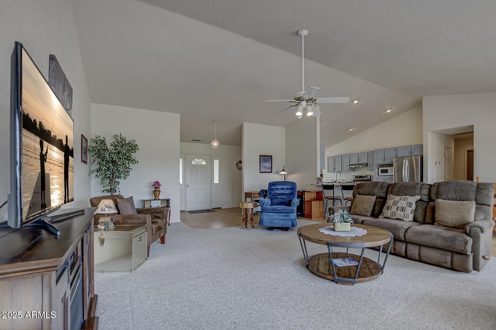 155 Claxton Road Payson, AZ 85541 - Photo 5 of 46 a living room with furniture and a flat screen tv