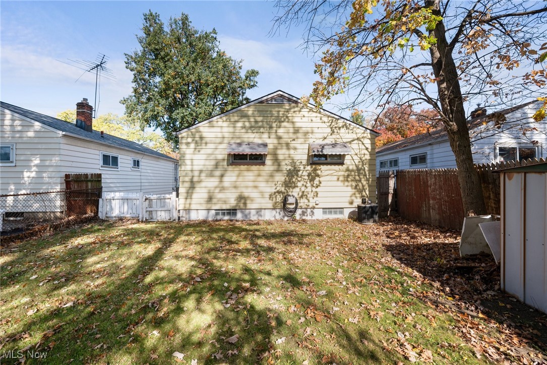 16913 Martha Road Cleveland, OH 44135 - Photo 23 of 26 Rear view of property featuring a yard