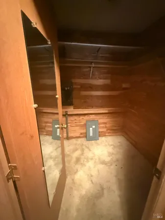 a bathroom with a granite countertop sink a toilet and shower