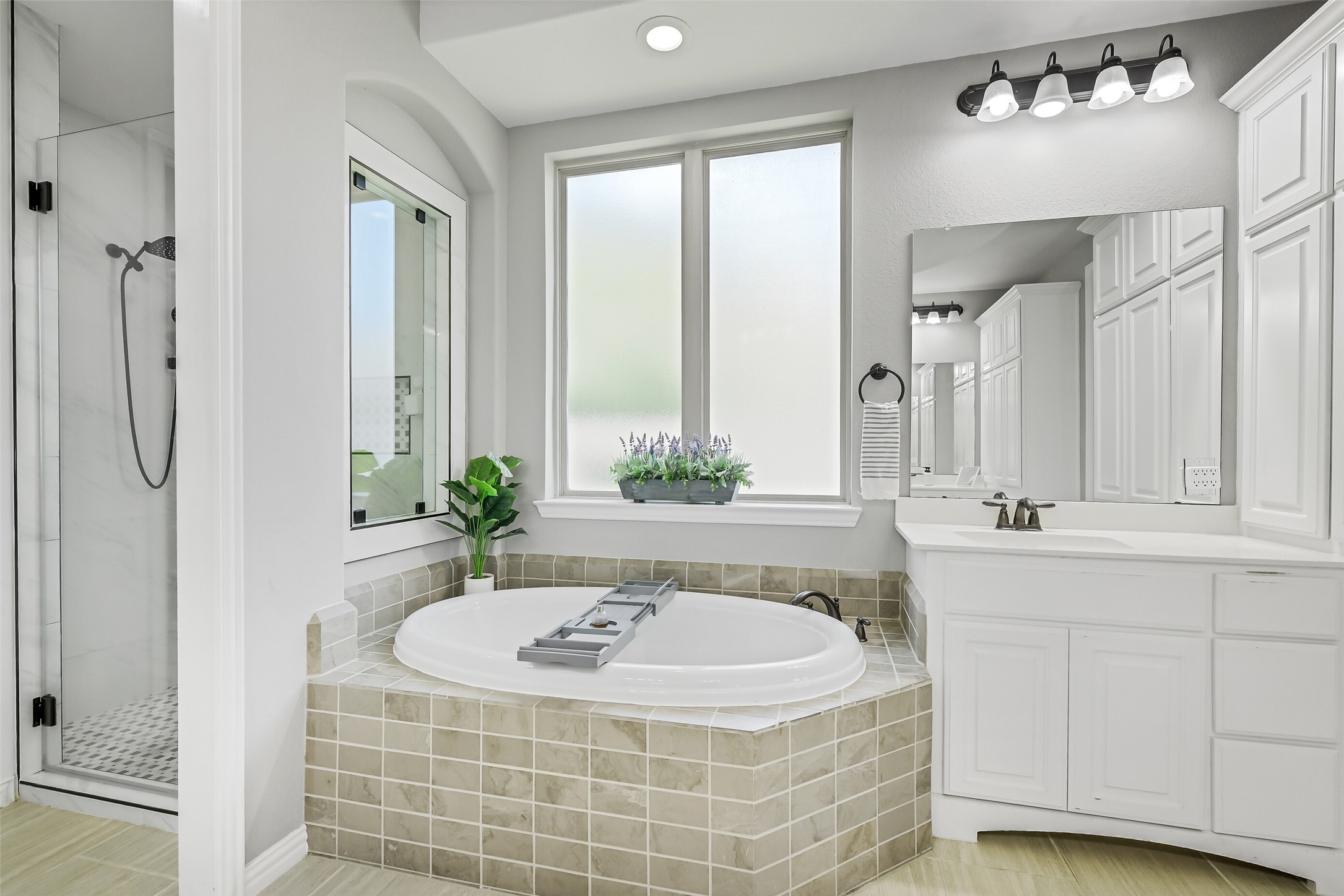 12207 Shorebridge Road Cypress, TX 77433 - Photo 21 of 41 a bathroom with a tub sink and mirror