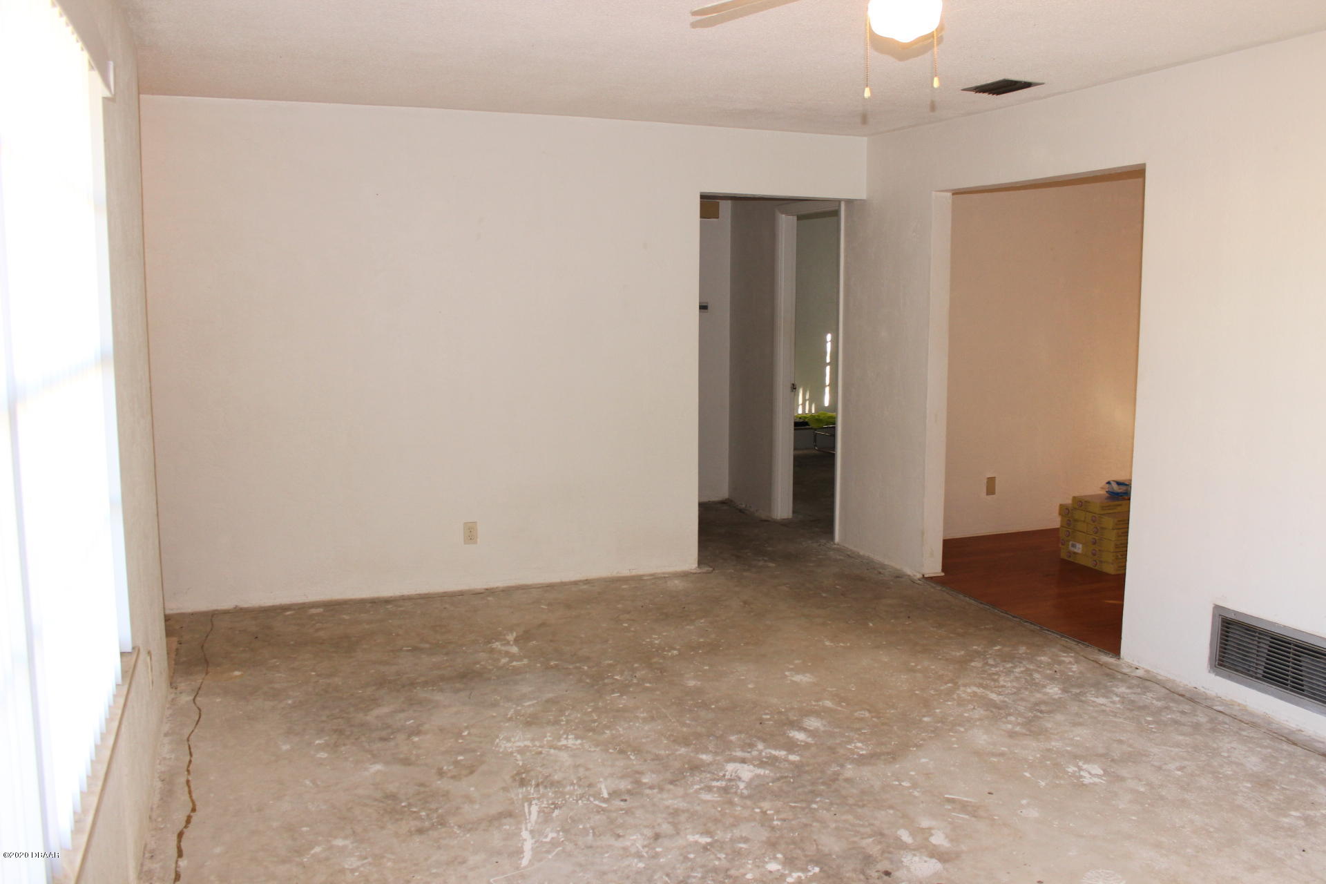 71 Cindy Lane Ponce Inlet, FL 32127 - Photo 5 of 25 Living Room To Dining Room and Hallway