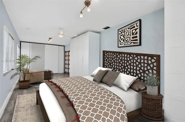 a bedroom with bed and a night stand