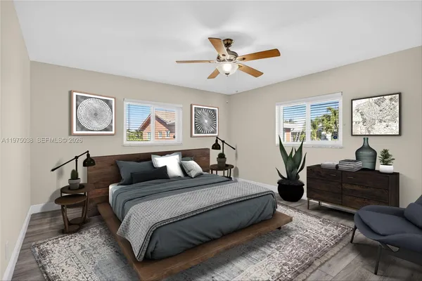 a bedroom with a bed couch and window