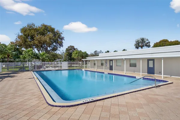 a view of a swimming pool with a lounge chair