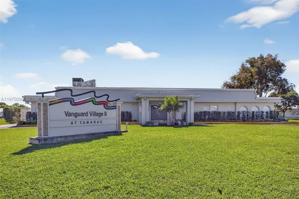 a sign on the side of the house