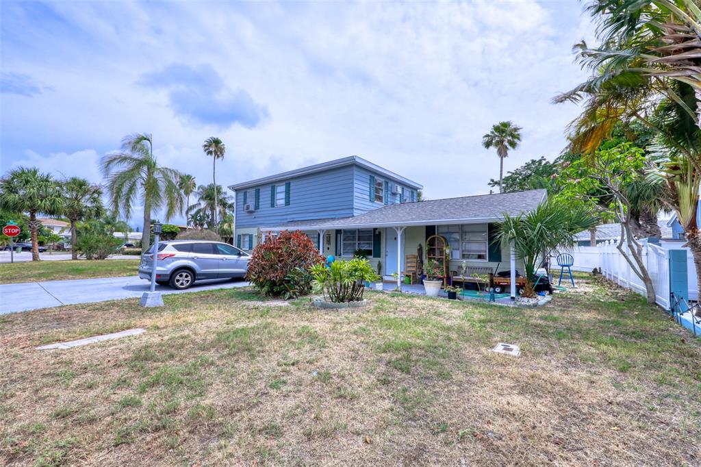 14000 Miramar Avenue Madeira Beach, FL 33708 - Photo 1 of 1 a view of a house with a yard and sitting area