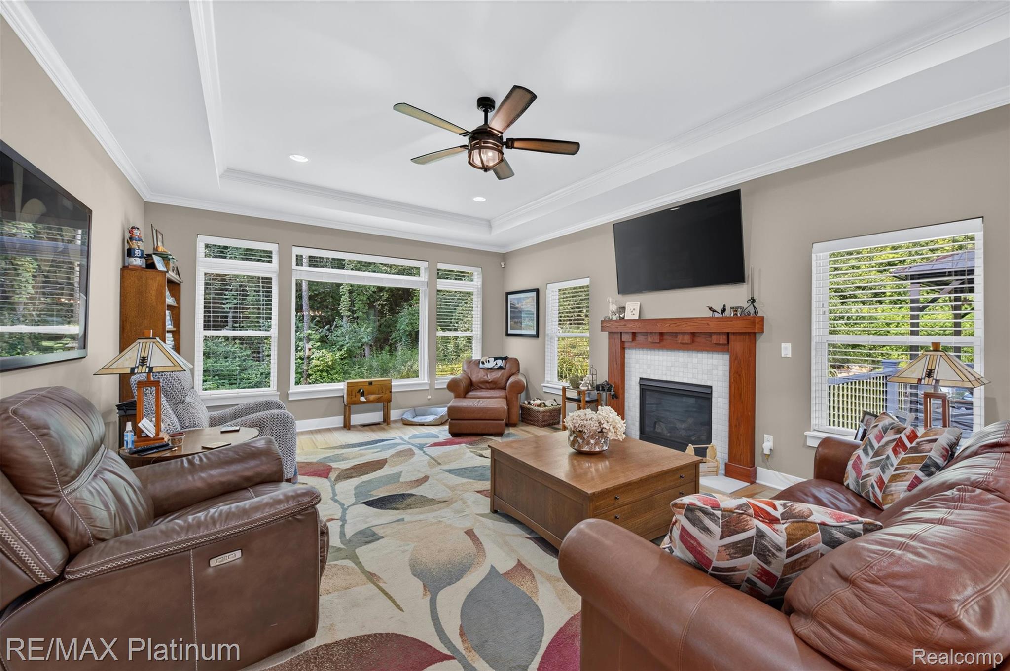 2676 Crooked Lake Road Howell, MI 48843 - Photo 11 of 60 Spacious living area featuring a tray ceiling, recessed lighting, and a ceiling fan