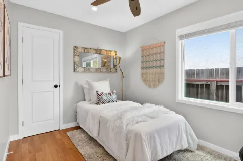 a bedroom with a bed and a window
