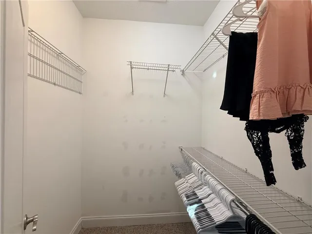 a living room with furniture and a gate