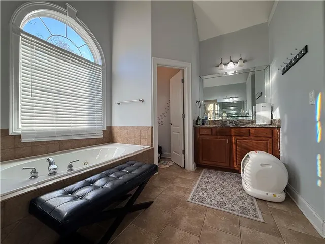 a white toilet sitting next to a bathroom sink